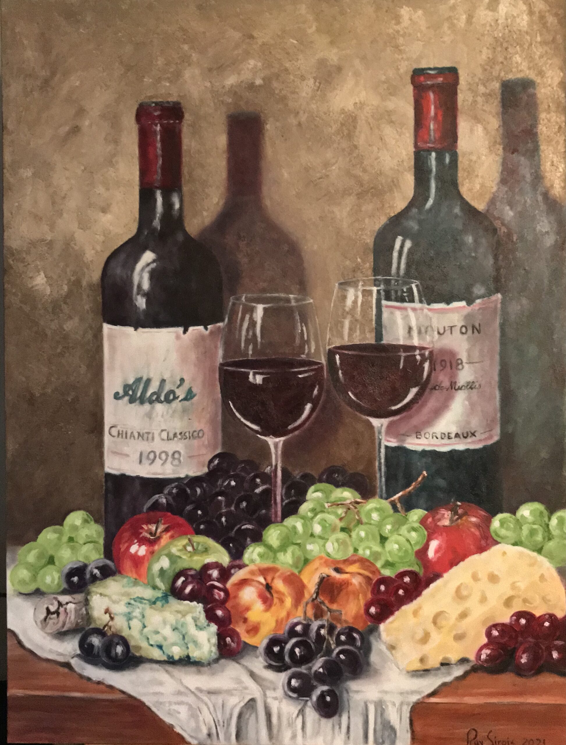 Two wine bottles with fruit & Cheese