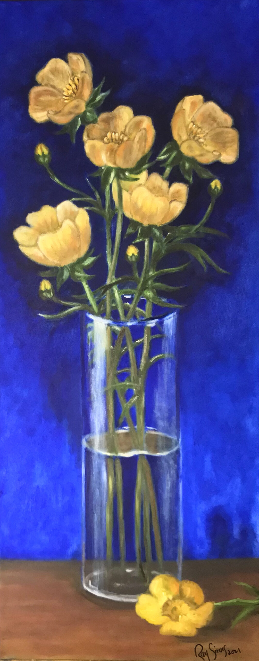 Buttercup flowers in glass vase